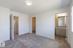 Plush carpeting, recessed lighting, and a walk-in closet - 