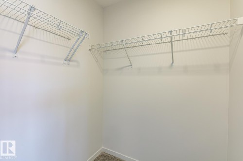 Wire shelving system with white finish - 3611 Triomphe Boulevard, Beaumont, AB 