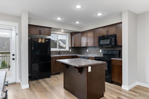 2174 Trumpeter Way Nw, Edmonton, AB - Indoor Photo Showing Kitchen With Double Sink