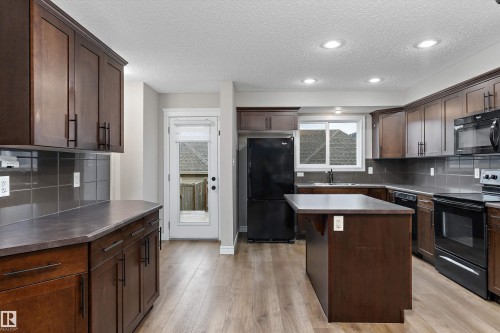 2174 Trumpeter Way Nw, Edmonton, AB - Indoor Photo Showing Kitchen With Double Sink