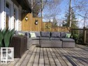 Expansive wood-plank deck with a privacy fence, wood siding, and durable metal railing - #417 61314 Rr 463, Rural Bonnyville M.D., AB 