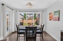 Hardwood-finish flooring, white walls, and a contemporary ceiling light fixture - 1115 61 Street Sw, Edmonton, AB 