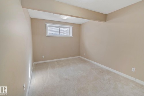 Recessed window, neutral-toned walls, and plush carpeting - 1115 61 Street Sw, Edmonton, AB 