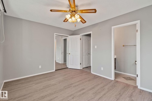 Wood-finish flooring with light gray walls - 14724 73 Street Nw, Edmonton, AB 