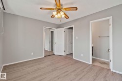 Wood-finish flooring with light gray walls - 