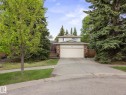 Two-story residence featuring a two-car garage, brick facade accents, and a concrete driveway - 4 Lovatt Place, St. Albert, AB  - Outdoor 