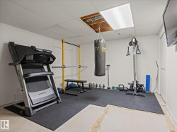 Dedicated fitness area featuring rubber mat flooring - 