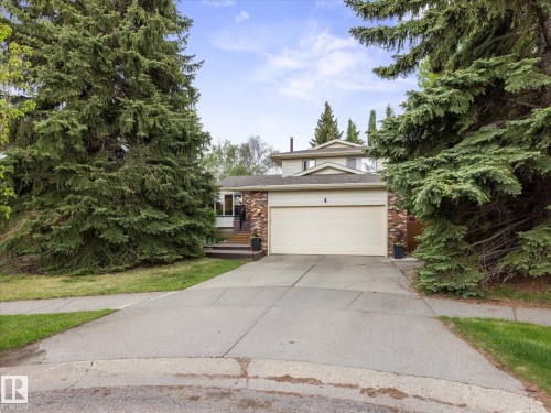 Split-level residence featuring a brick facade and a two-car garage - 4 Lovatt Place, St. Albert, AB - Outdoor