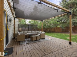 Expansive wood deck with a partial overhead shade structure - 