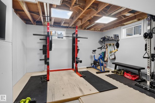 Finished room featuring light gray walls, exposed ceiling joists, and recessed lighting - 14611 109 Avenue Nw, Edmonton, AB 