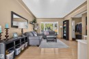 Bay window, wood-finish flooring, built-in shelving, front entry closet, and arched doorway - 14611 109 Avenue Nw, Edmonton, AB 