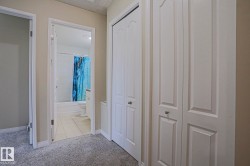 Wall-to-wall carpeting with multiple built-in storage closets, offering ample storage - 