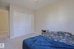 Wall-to-wall carpeting, bi-fold closet doors, and light-toned wall finishes - 