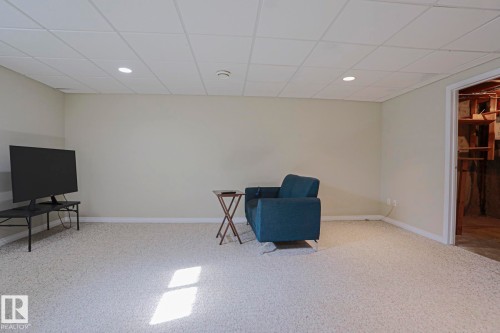 Recessed lighting, painted walls, wall-to-wall carpeting, and a drop ceiling - 319 Telford Court, Leduc, AB 