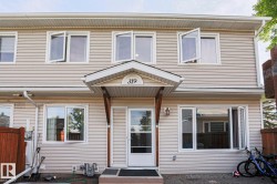Vinyl siding exterior with white trim - 