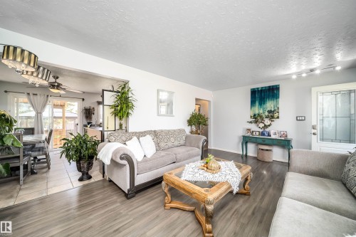 Wood-finish flooring in the living area - 10245 160 Street Nw, Edmonton, AB 