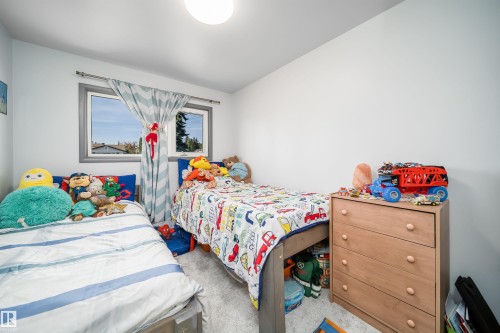 Neutral wall paint, window with gray trim, and a ceiling-mounted light fixture - 10245 160 Street Nw, Edmonton, AB 