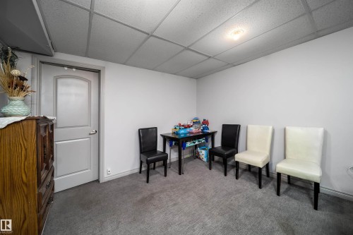 Recessed lighting, light gray walls, gray carpet flooring, white paneled door, drop ceiling - 10245 160 Street Nw, Edmonton, AB 