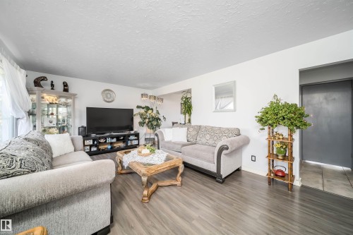 Wood-finish flooring throughout, bright white walls, and a recessed ceiling - 10245 160 Street Nw, Edmonton, AB 