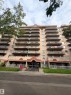 Multi-story residential building with private balconies and a ground-level entrance - #503 11211 85 St Nw, Edmonton, AB 