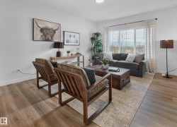 Recessed lighting, wood-finish flooring, and large windows with privacy drapes - 