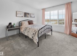Expansive window with multiple panes, offering ample natural light and distant scenery - 