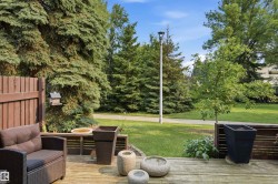 Expansive wooden deck featuring perimeter fencing - 