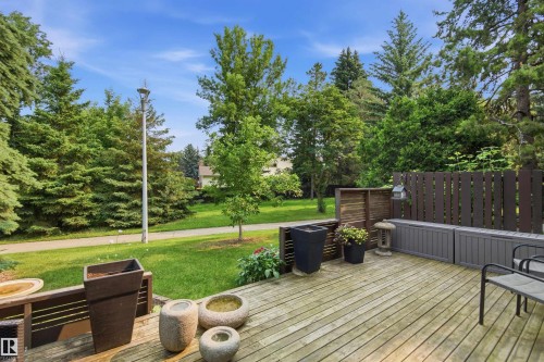 Expansive wood deck with a privacy fence and built-in storage benches - 141 Hearthstone Nw, Edmonton, AB - Outdoor With Deck Patio Veranda