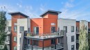 Contemporary multi-story building featuring multiple balconies with glass railings - #411 304 Ambleside Link Li Sw, Edmonton, AB 