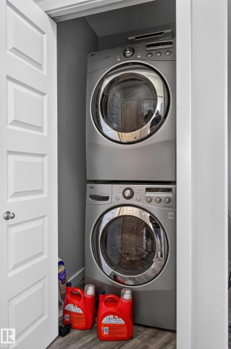 Stackable washer and dryer unit within a dedicated utility closet - #411 304 Ambleside Link Li Sw, Edmonton, AB 