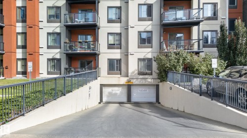 Underground parking access ramp with concrete retaining walls - #411 304 Ambleside Link Li Sw, Edmonton, AB 