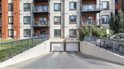 Underground parking access ramp with concrete retaining walls - 