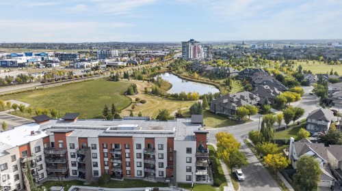 Modern multi-story building featuring multiple balconies and a flat roofline - #411 304 Ambleside Link Li Sw, Edmonton, AB 