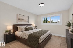 Recessed ceiling light fixture, wood-finish flooring, and a large horizontal window with white trim - 