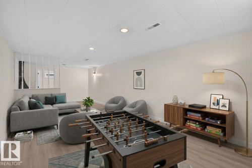 Recessed lighting illuminates the room, featuring wood-finish flooring - 13511 114 Street Nw, Edmonton, AB 