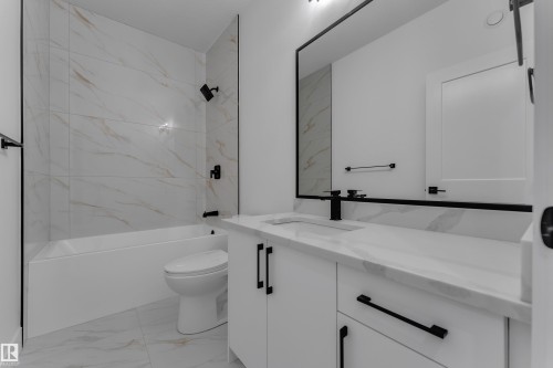 White tiled shower with matte black fixtures - 4212 63 Street, Beaumont, AB 