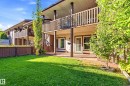 Expansive rear lawn with mature trees and a fenced perimeter - 258 Surrey Gardens Nw, Edmonton, AB 
