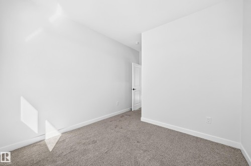 Neutral wall tones with a carpeted floor - 9 Tilia Place, Spruce Grove, AB 