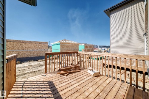 Expansive outdoor deck with natural wood-finish railing - 9 Tilia Place, Spruce Grove, AB 