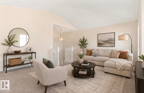 Vaulted ceiling amplifying the spacious living area - 1007 Macewan Close Sw, Edmonton, AB - Indoor Photo Showing Living Room