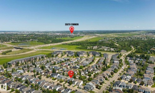 Aerial perspective showcasing a residential neighborhood with surrounding infrastructure and green spaces - 1007 Macewan Close Sw, Edmonton, AB - Outdoor With View
