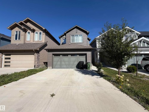 Two-story residence with a two-car garage and a concrete driveway - 2628 Donaghey Crescent Sw, Edmonton, AB 