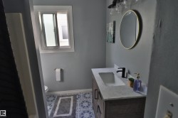 Custom vanity with integrated rectangular sink and matte black faucet - 