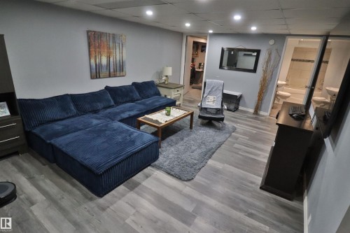 Recessed lighting, wood-finish flooring, and light gray wall paint - 4113 - 42 B Ave, Leduc, AB 