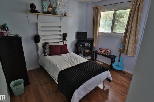 Wood-finish flooring, single window, and light-toned walls - 4113 - 42 B Ave, Leduc, AB 