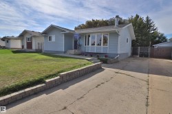 Light blue siding exterior with a prominent bay window - 