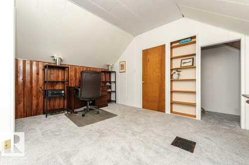 Vaulted ceiling with white paneling and light gray carpeting - 10507 67 Avenue Nw, Edmonton, AB 
