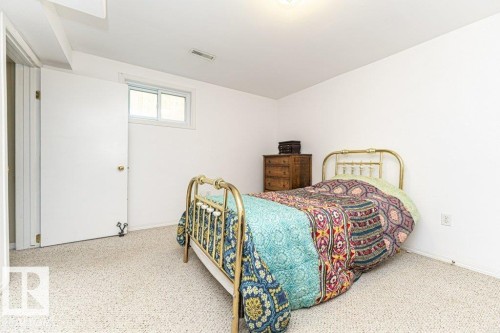 Carpeted flooring, white walls, white window frame, and a white door - 10507 67 Avenue Nw, Edmonton, AB 