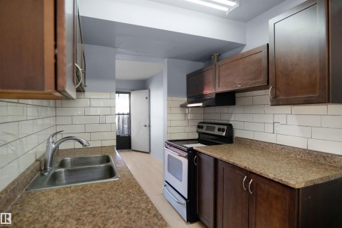 887 Abbottsfield Road Nw, Edmonton, AB - Indoor Photo Showing Kitchen With Double Sink