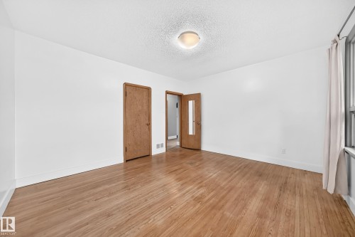 One of 2 Bedrooms with Hardwood flooring throughout - 12045 64 Street Nw, Edmonton, AB 